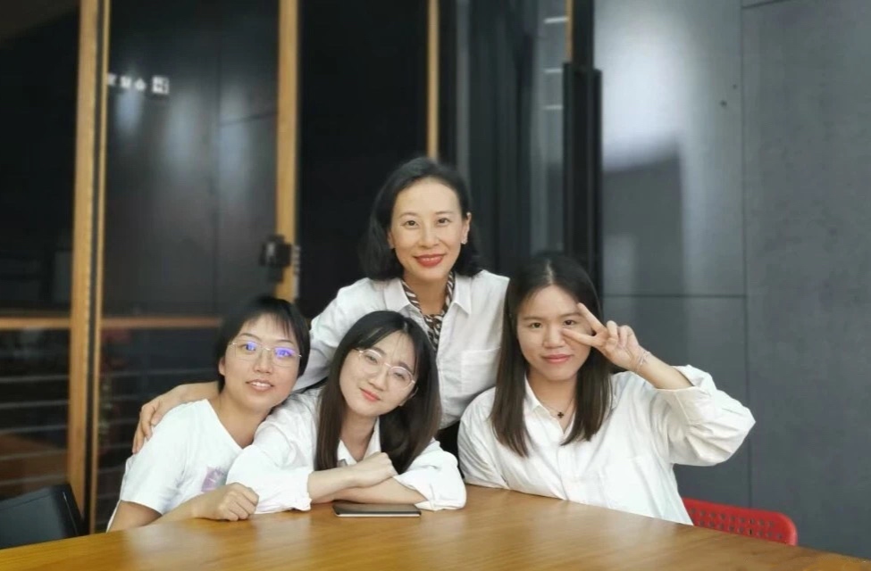 Xia Baojun (back row) with three of her students..jpg